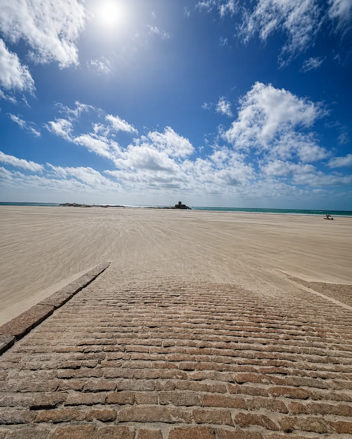 Jersey causeway beneath a dramatic sky